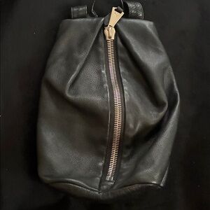 Black Leather Backpack with Silver Zipper.